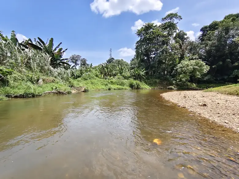 The shallow river at Laman Pok Nik with a gravel bank